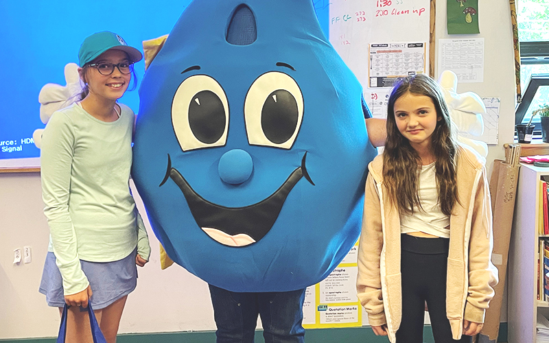 Fifth-grader Leslie Rayburn, left, and fourth-grader Geneva Wilson, right, from the Fayston Elementary School each won the Vermont Drinking Water Week poster contest for their grade level and Mr. Bergstein's class received a visit from Sir Hydrologic and a few members from the DWW committee. The class learned more about how to keep water clean and how they can help protect the environment. Photo: Sir Hydrologic