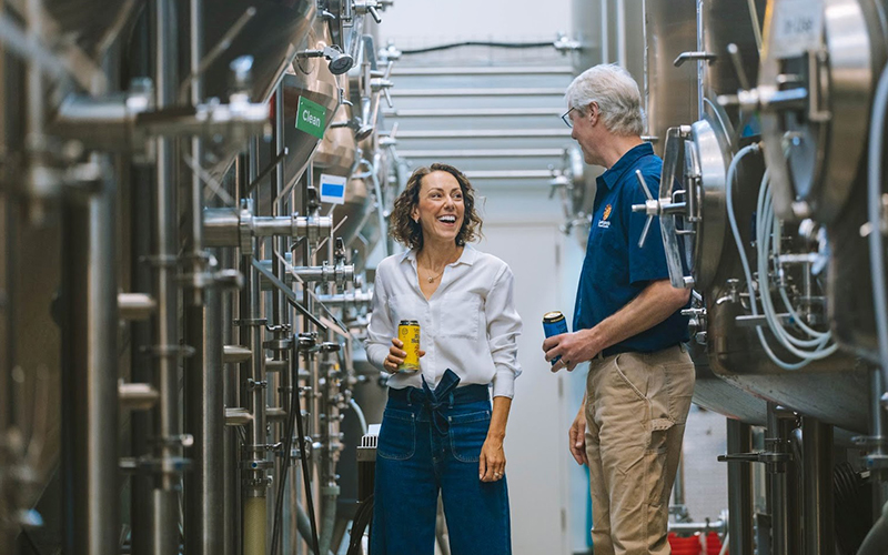 Adeline Druart (left) and Sean Lawson (right) in the brewery at Lawson’s Finest. Druart has been named CEO of the company. Company founders Sean and Karen Lawson will remain fully engaged and present at the Waitsfield business. Photo courtesy Lawson’s Finest