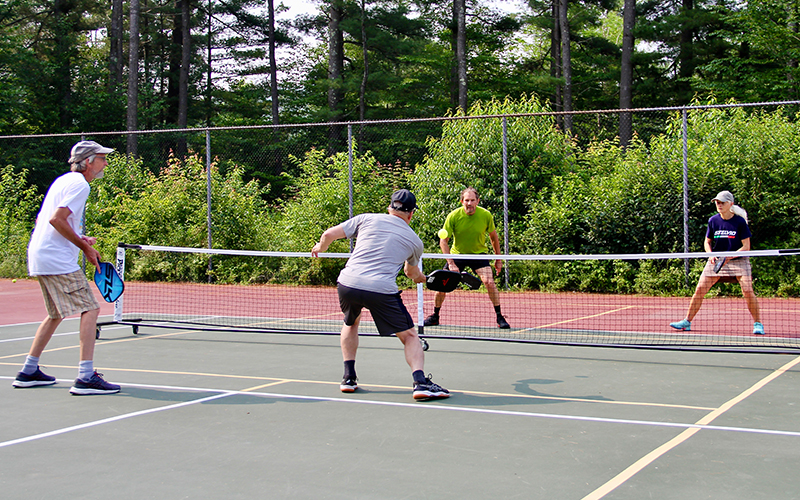 Pickleball players in Warren, Vermont. L-R: Mark Ferguson, Mike Clement, Gary Kessler, and Jessica Williams Photo: Roarke Sharlow