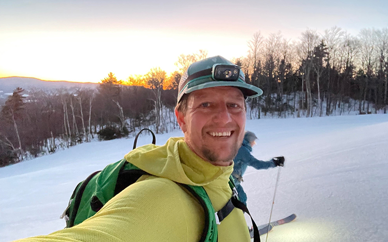Luke Foley skinning up a mountain, Luke enjoys skiing around the Mad River Valley.