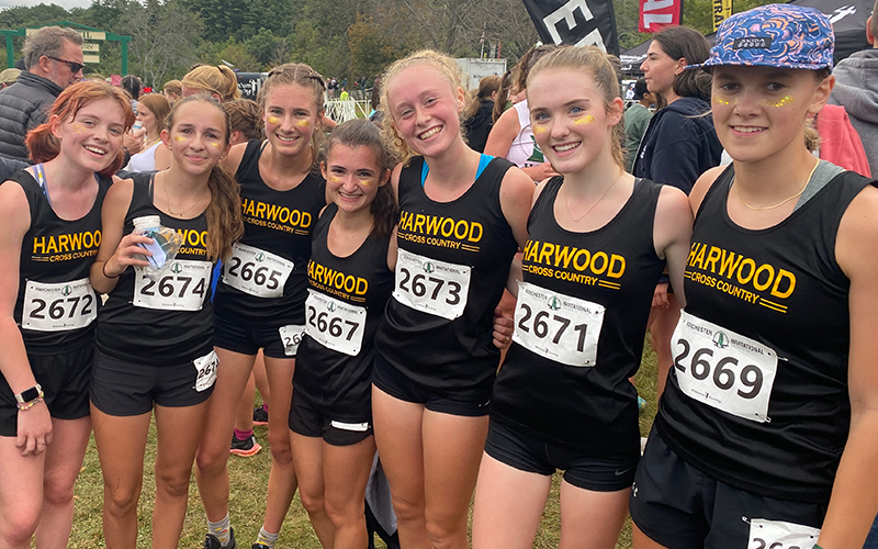 Girls’ varsity team all smiles at the finish line after outstanding performances that gained them a spot on the podium: (L to R) Eireann McDonough, Celia Wing, Rowan Clough, Pippa Diller, Julia Thurston, Hazel Lillis, Heidi Haraldsen. Photo: Robert Cummiskey