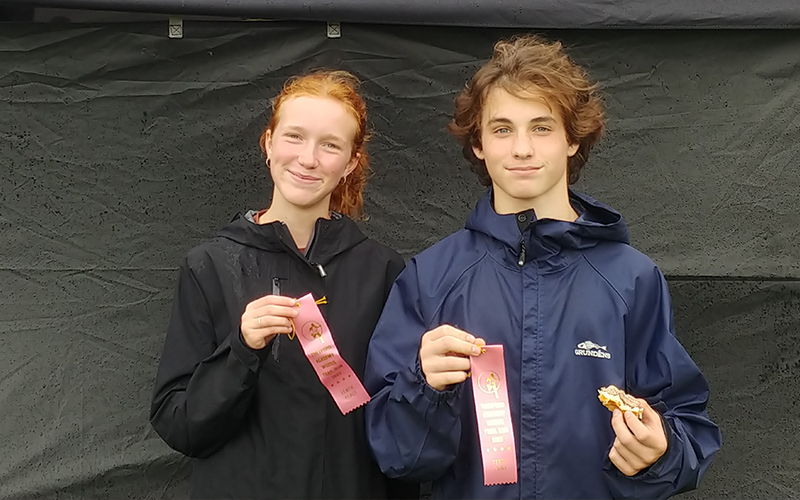 Julia Cisz, freshman, and Chapin Rivers sophomore display awards for finishing in the top 10 of their respective divisions.