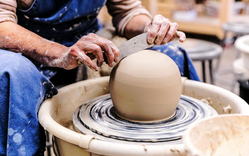 Stuart Gair shaping clay at Blockhouse Studio in Waitsfield, VT.