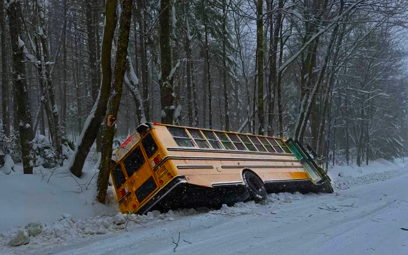 File photo of school bus off road in a snowstorm.