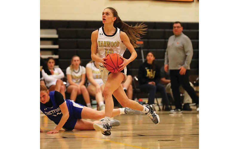 Harwood junior Eloise Lilley heads to the basket in a game against Thetford on January 23. Harwood came out on top.