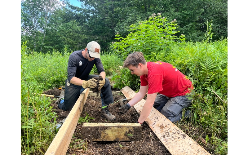 VLT staff working on a wooden footbridge at the Pratt Refuge in 2025