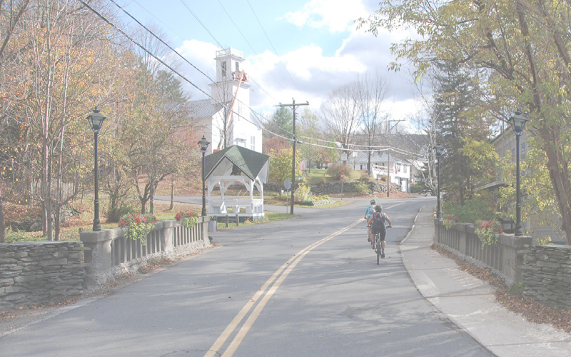 Warren Village with a biker on the road