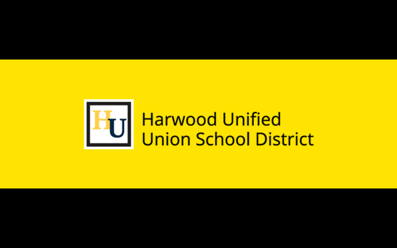 HUUSD logo on a yellow field with black bars top and bottom